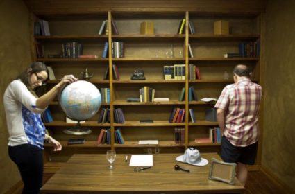 Katrina Zborowsky, 21, of Winnipeg, left, and Larry Gates of Anaheim leave no stone unturned to find any clues while playing the Sherlock Room at Exodus Escape Rooms in Anaheim. Groups are locked into a room and tasked with finding clues to escape the room. A one-hour time limit is placed, and only one clue is given, if needed. ///ADDITIONAL INFORMATION :2/13/15 0220.YBL.EscapeRoom.mm - MATT MASIN, STAFF PHOTOGRAPHER